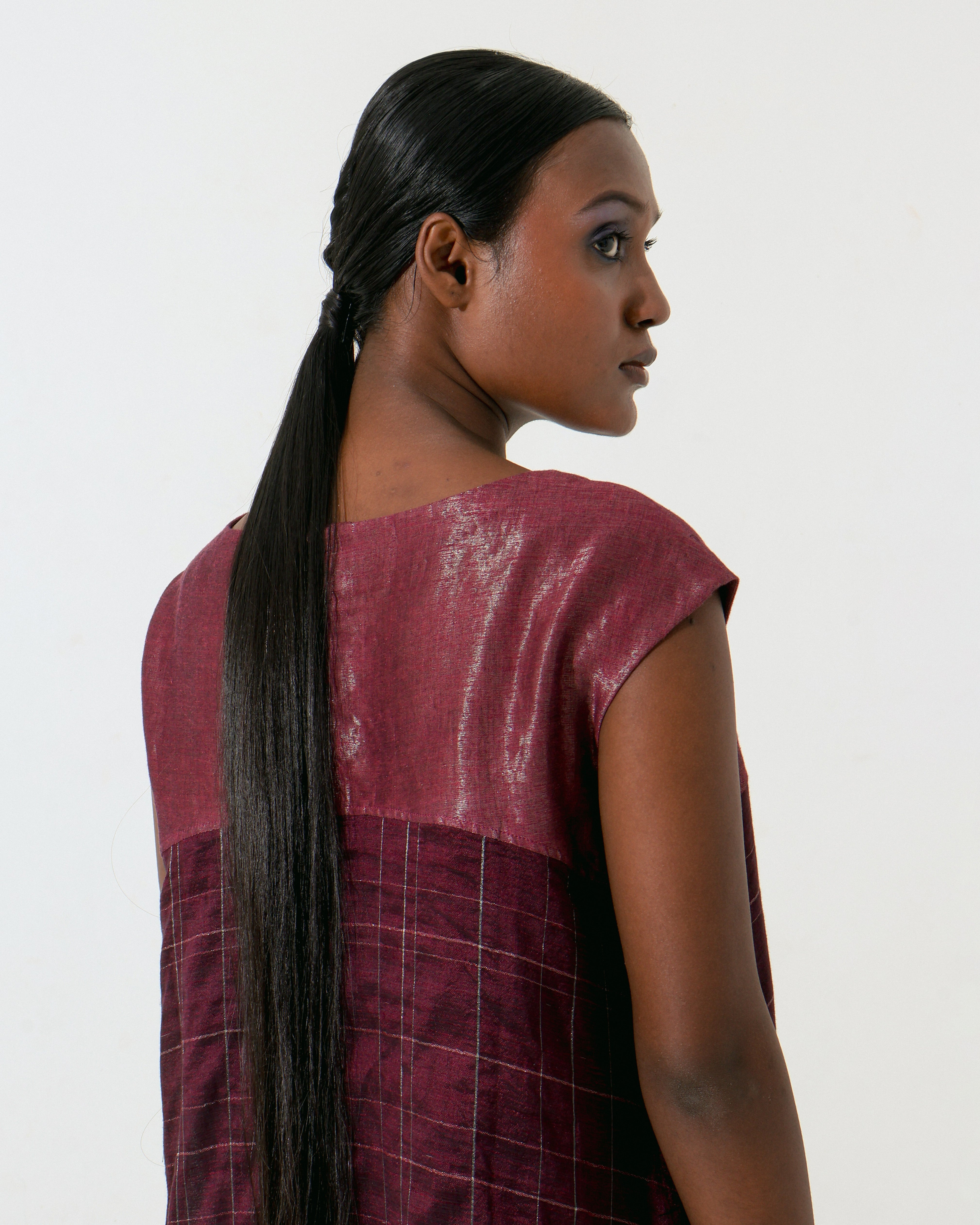 The Shoonyata Lunar Dress is a sleeveless garment with a relaxed silhouette that flows elegantly Made from handwoven silk using the traditional weaving technique.