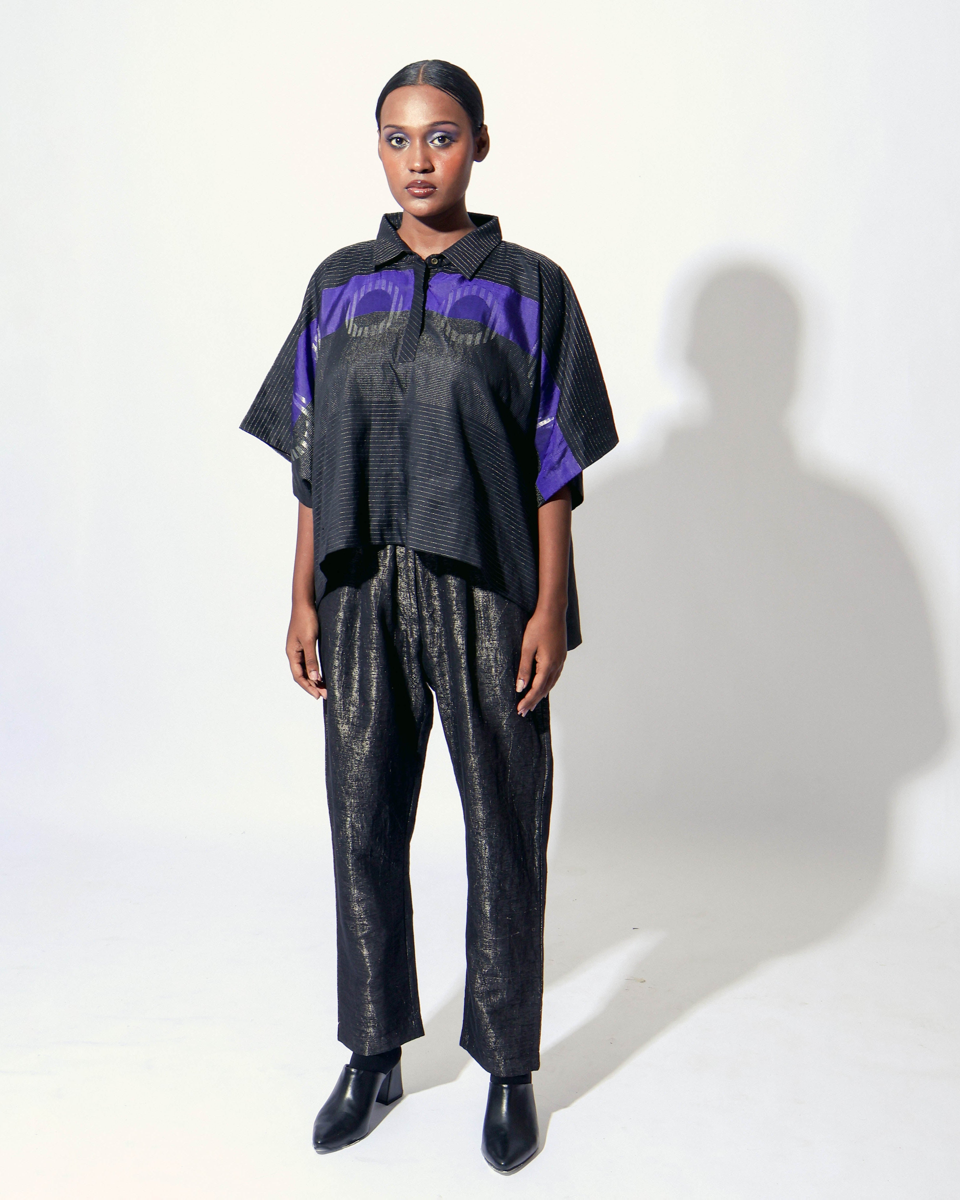 The Shoonyata Burnished Tissue Pants are crafted from silk tissue fabric with a subtle burnished finish, creating a soft shimmer. These relaxed-fit pants feature a gently tapered silhouette that combines comfort with contemporary style.